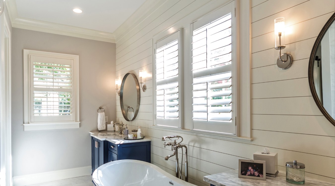 Boston bathroom with white plantation shutters.