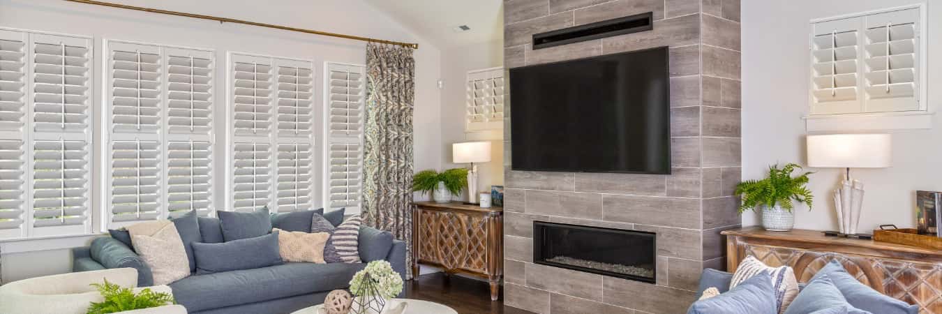 Interior shutters in Medford family room with fireplace