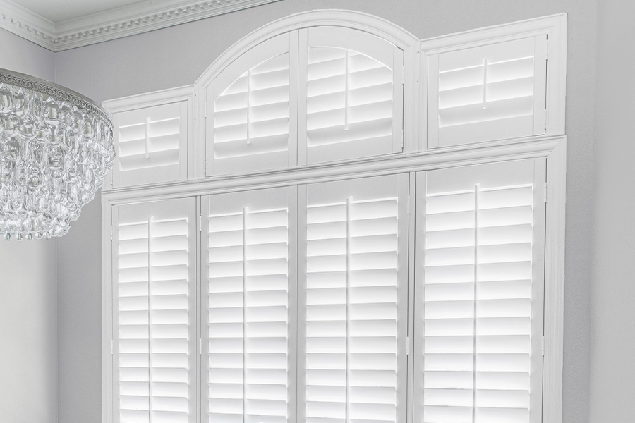 White Polywood shutters in a gray dining room