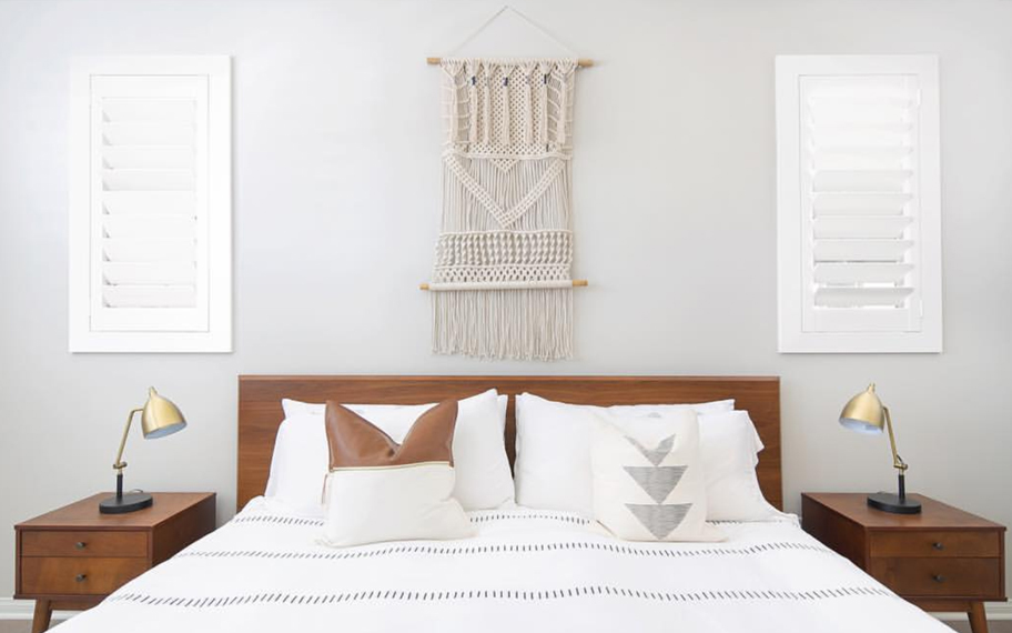 Custom-fitted louvered shutters provide excellent nighttime privacy in Boston. Photo Credit: Audrey Crisp Louvered shutters in a bedroom.