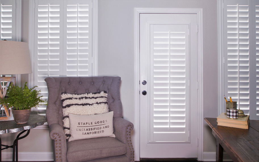 Interior shutters are beautiful and durable window treatments for glass doors in Boston. Polywood shutters on a door