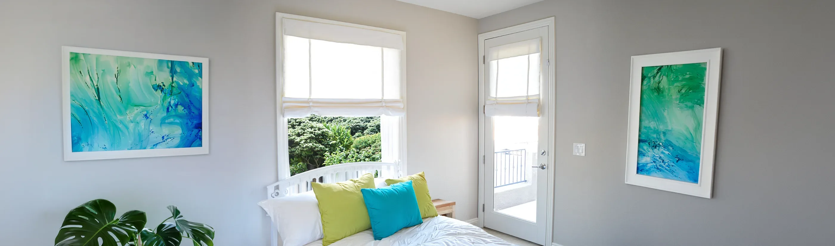 white tumble shades on bedroom window and patio door