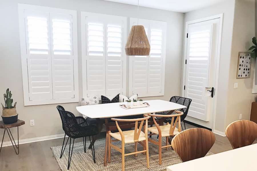 Use Polywood shutters to control natural light levels in your Boston dining room. Polywood shutters with top louvers tilted open in a dining room