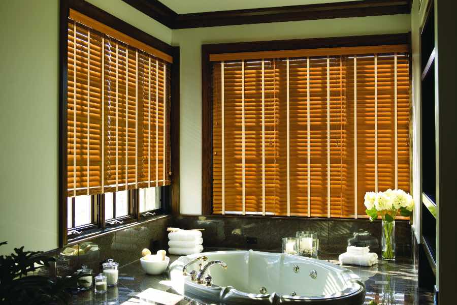 Exact measurements are the key to blinds that look and work as they should. Wood blinds on two bathroom windows