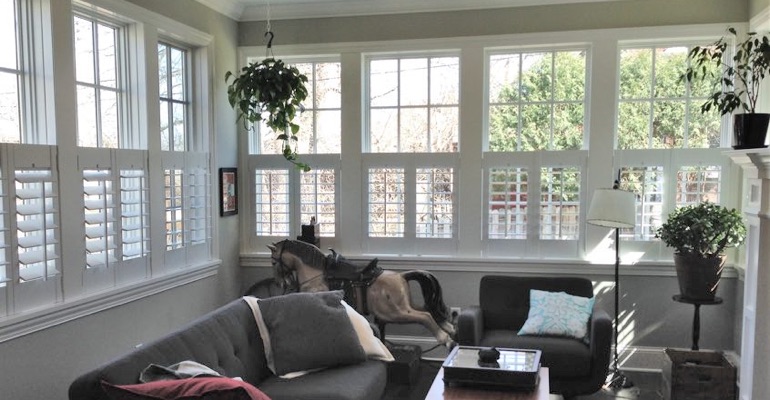 Cafe shutters in a sunroom in Boston. Boston cafe shutters living room
