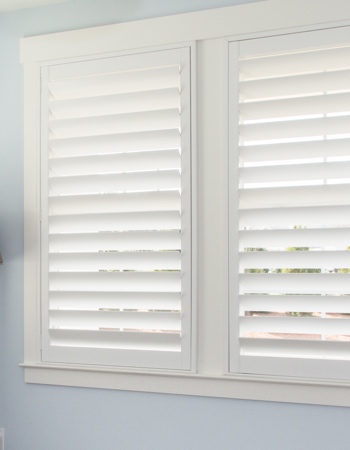 Hidden tilt rod shutters closed. White plantation shutters with hidden tilt rods in Boston