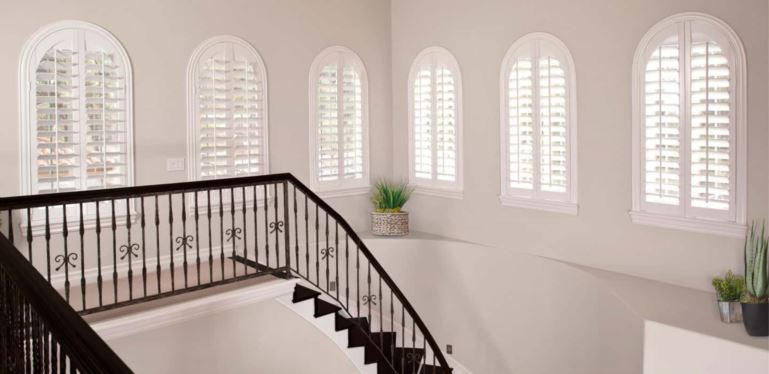 Custom-made coverings cover your entire window without sticking out and catching on the trim. Arched Plantation Shutters