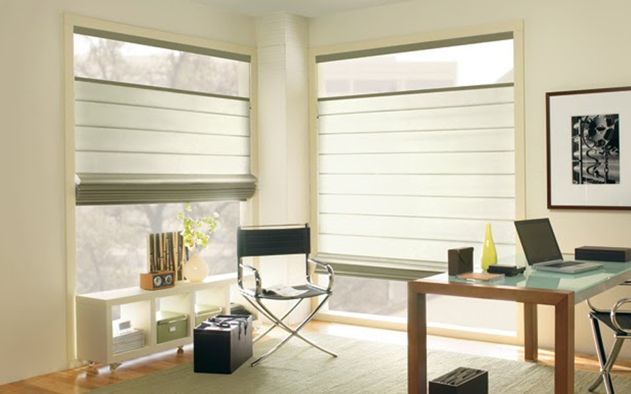 Upgrade your windows with stylish window shades or shutters in Boston. Stylish sheer shades in the corner of a modern office.