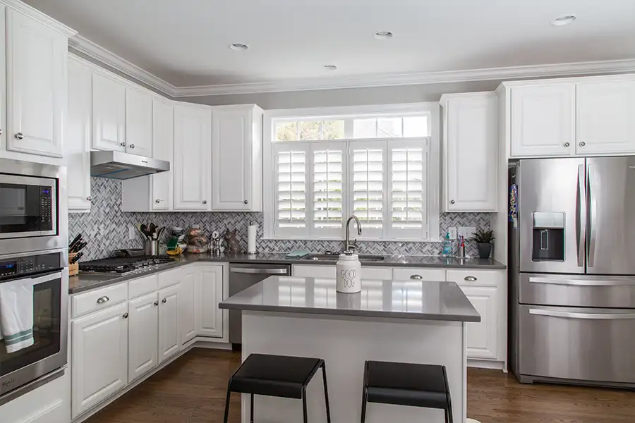Use your tax refund to buy matching kitchen appliances and give your kitchen a high-end look. A modern kitchen with matching stainless steel fridge, dishwasher, and double oven