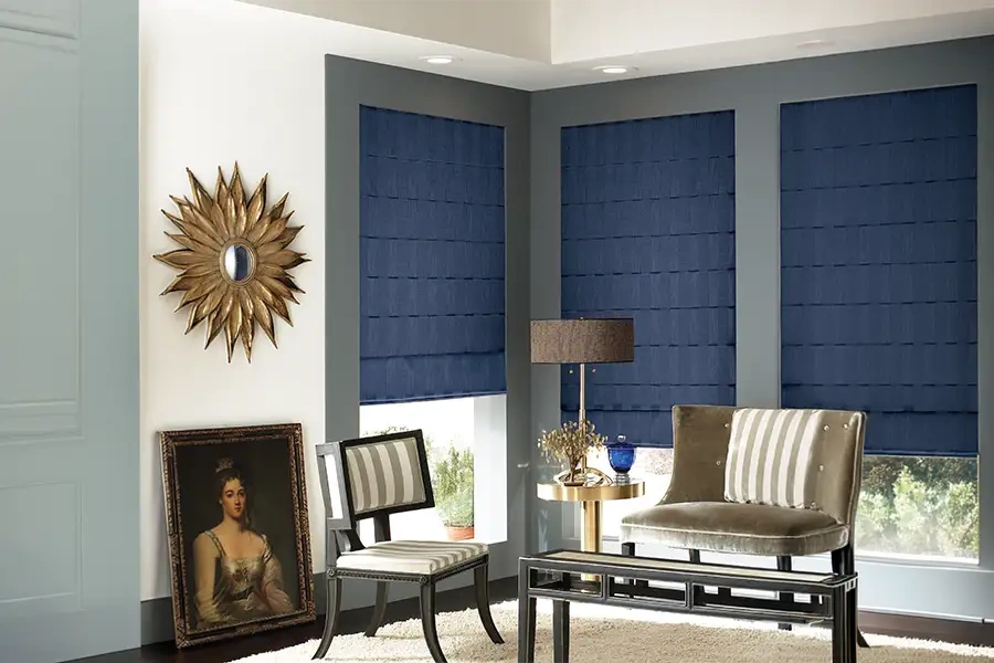 Blue Roman shades in a corner of a formal living area