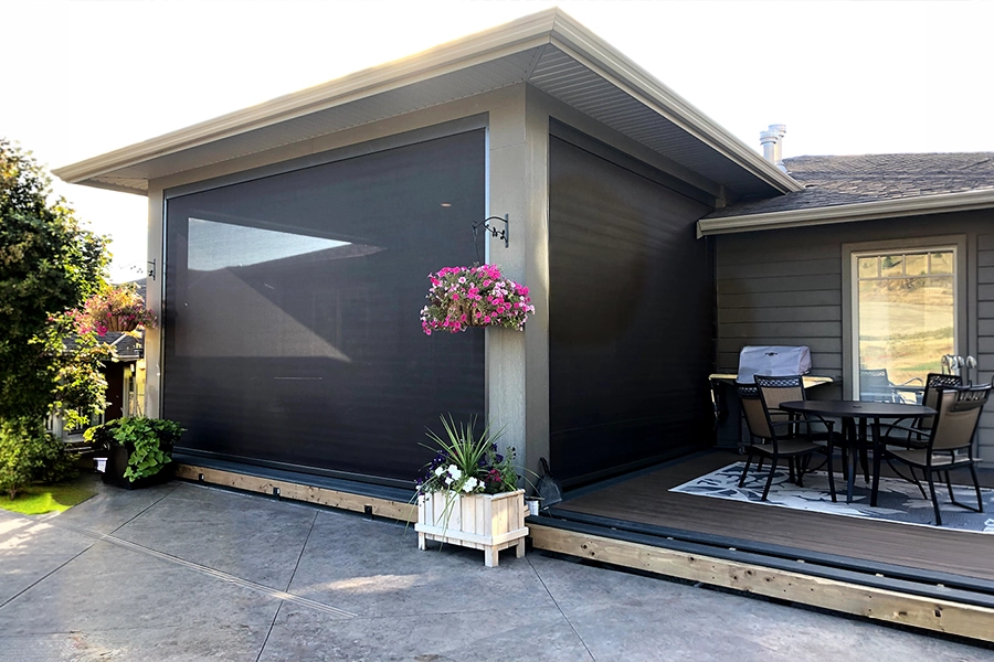 Create more space for relaxing, entertaining, and living by enclosing your patio wiith retractable screens that you can open and close as needed. A covered home patio enclosed with screen shades